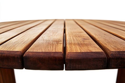 A sturdy wooden patio table with smooth slats is situated in the middle of a bright white background, emphasizing its design and craftsmanship. Ideal for outdoor gatherings and meals.