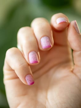Two Colors Thermo Nail Polish - Light Pink and Bright Pink Lacquer or Gel. Trendy Duo Color Manicure. Female Hands With Pink Manicure - Beauty Background