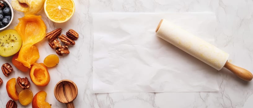 Assorted baking ingredients with a rolling pin on a marble surface, perfect for pastry preparation.