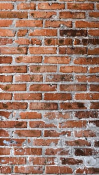 Panorama of red old brick wall. Detailed texture of aged masonry with broken bricks and peeling plaster. Pattern of loft interior or exterior background. Urban, grunge, industrial, abstract backdrop
