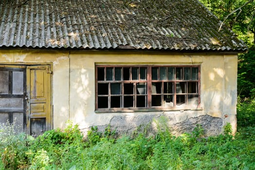 Old and very ruined buildings outside Kharkiv, in an Ukrainian forest