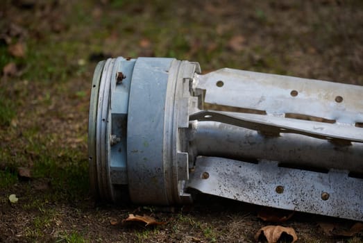 The tail section of a 220 mm rocket for the Uragan rocket fire system on a city flowerbed in Mykolaiv