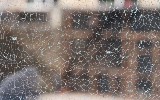 Cracked clear glass full frame. Close up