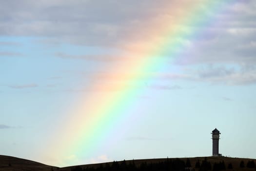 Colourful natural spectacle: After a short rain shower and the sun coming through again,the highest elevation in Baden-Württemberg,the Feldberg Tower,presented itself with a rainbow