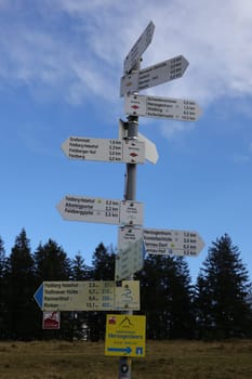 Signposts,route signs on the Herzogenhorn near the Feldberg show hikers the length and direction of the route