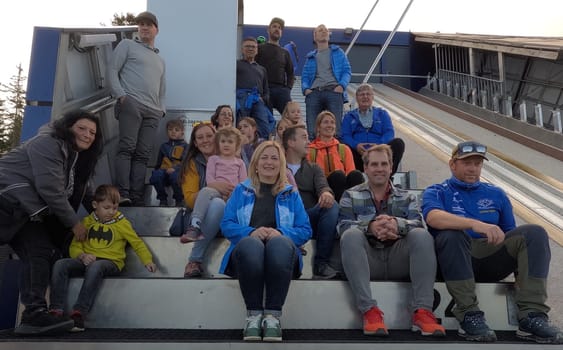 Group of visitors on the inrun tower during the ski jump tour at the open day at SC Hinterzarten