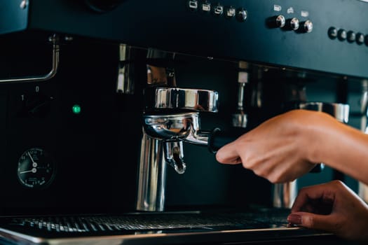 Coffee machine preparing fresh tasty coffee in cafe. Step by step tips of coffee making process. Close up of machine hand holding handle showcasing professional brewing.