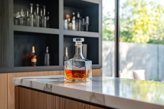 Stylish home bar featuring crystal whiskey decanter on marble countertop, wooden cabinets and shelving.