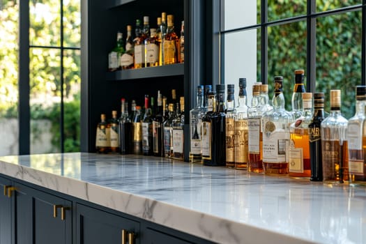 Bright home bar with marble countertop displaying various spirits, backdropped by lush garden view through large windows.