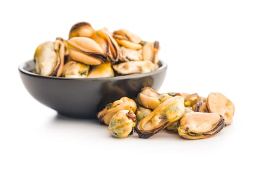 Shelled mussels meat in bowl isolated on a white background.