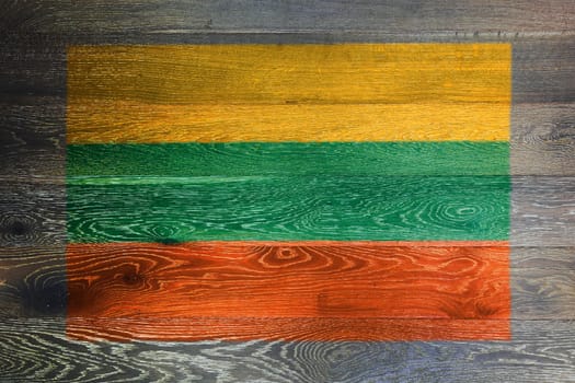 A Lithuania flag on rustic old wood surface background