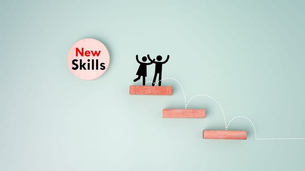 Skills icon and human drawing on wooden block. Upskilling and personal development concept. Employee thinking, digital upskill, Skill training, education, learning, ability. Upskilling, reskilling.