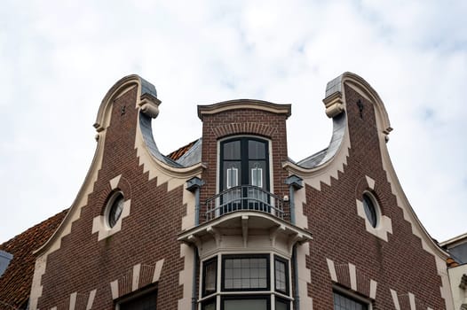 Colorful house facades with sky in the old town of Alkmaar in the Netherlands