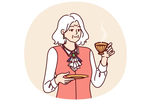 Elderly rich aristocrat woman drinks tea from golden mug and is dressed in exquisite expensive clothes with elegant accessories. Arrogant old woman is aristocrat and personifies power or snobbery.