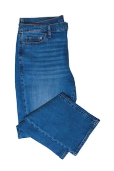 Jeans isolated. Folded trendy stylish blue denim stretch pants or trousers for men isolated on a white background. Clipping path. Jeans summer and autumn fashion.