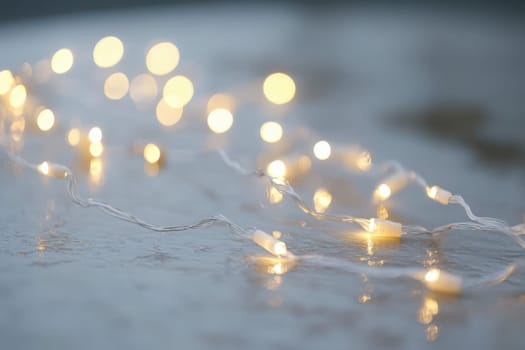 Delicate fairy lights twinkle softly on a pristine surface, creating a warm and inviting atmosphere as twilight descends. The gentle glow enhances the charm of the surroundings.