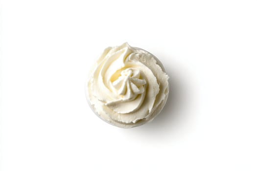 A creamy swirl of sour cream is artistically presented in a glass dish against a clean white backdrop. The texture and sheen highlight its freshness and creamy consistency.