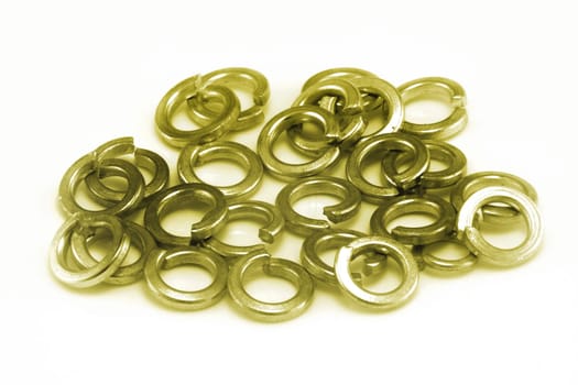 A pile of phosphor bronze split spring washers on white background