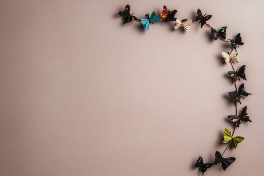 A vibrant display of butterflies is arranged along a light-colored wall, celebrating the beauty of nature in a creative way.