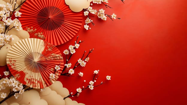 Traditional fans and delicate blossoms are beautifully arranged against a bright red backdrop, creating a festive atmosphere.