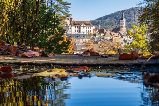 Autumn view of the old spa town of Baden-Baden reflected in a fountain, Baden-Württemberg, Germany