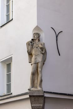 Innsbruck, Austria - February 26, 2023: Sculpture on the facade of townhouse on Herzog-Friedrich street