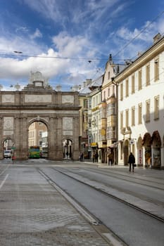 Innsbruck, Austria - February 26, 2023: Triumphal Arch (Triumphpforte) on Maria Teresa Street. It was built in 1765 to celebrate the wedding of Archduke Leopold and Maria Luisa