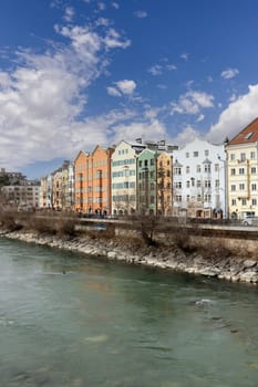 Innsbruck, Austria - February 26, 2023: Colourful Houses Innsbruck. The row of colourful houses on Mariahilf Street, boulevard along the Inn River