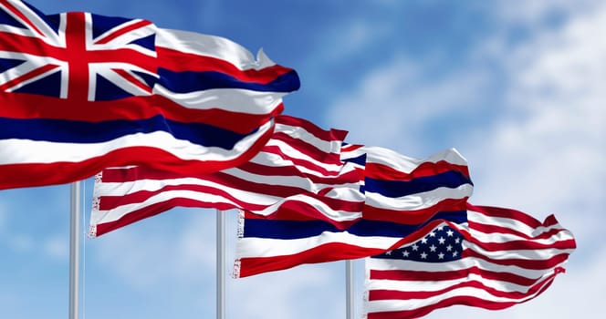 Hawaii state flags waving with the national flags of the United States of America on a clear day. 3d illustration render. Fluttering fabric. Selective focus