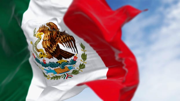 Mexico national flags waving on a clear day. Tricolor of green, white, and red with national coat of arms in the center of the white stripe. 3D illustration render. Rippled textile. Selective focus