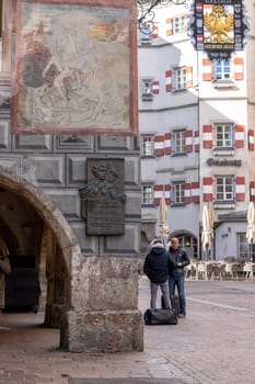 Innsbruck, Austria - February 26, 2023: Gasthof Goldener Adler, historical building on Herzog-Friedrich street. Ottoburg in a distance