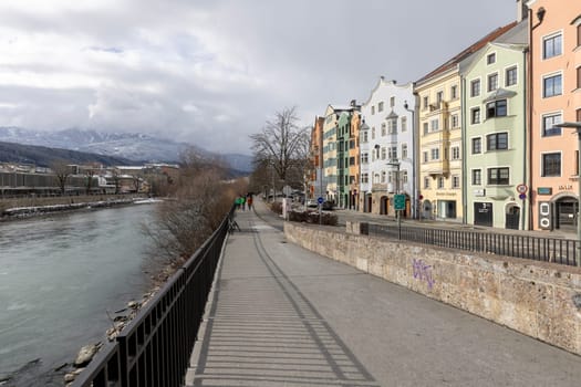 Innsbruck, Austria - February 26, 2023: Colourful Houses Innsbruck. The row of colourful houses on Mariahilf Street, boulevard along the Inn River