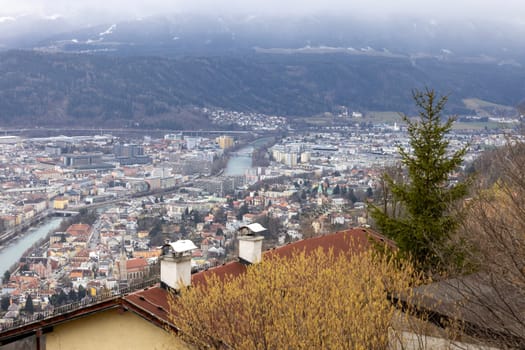 Innsbruck, Austria - February 25, 2023: Aerial view from Hermann Buhl square of the city with Inn River