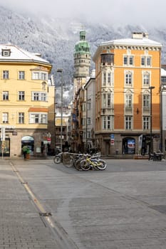 Innsbruck, Austria - February 26, 2023: View of Maria Theresa Street with City tower (Stadtturm),Town Hall located at Herzog-Friedrich street