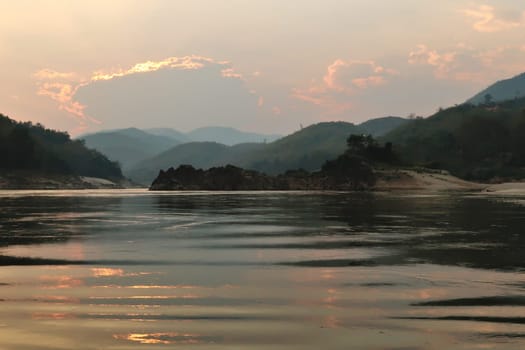 View from the slow boat from Thailand to Laos after sunset, Laos 2023