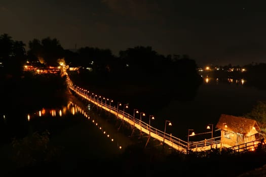 Night view, shot of the Bamboo Bridge over the Nam Khan River in Luang Prabang, Laos 2023