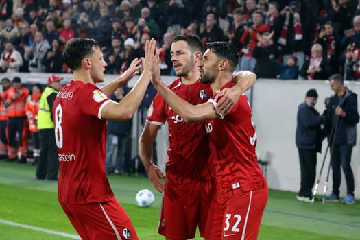 Vincenzo Grifo (SC Freiburg) scores from the penalty spot to make it 2-0 at half-time and celebrates his goal with his teammates in the 2024-25 DFB-Pokal match,2nd round: SC Freiburg vs Hamburger SV