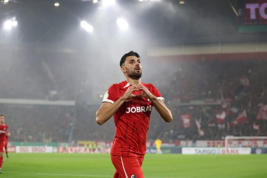 Vincenzo Grifo (SC Freiburg) scores from the penalty spot to make it 2-0 at half-time and celebrates his goal with his teammates in the 2024-25 DFB-Pokal match,2nd round: SC Freiburg vs Hamburger SV