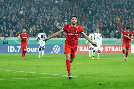 Vincenzo Grifo (SC Freiburg) scores from the penalty spot to make it 2-0 at half-time and celebrates his goal with his teammates in the 2024-25 DFB-Pokal match,2nd round: SC Freiburg vs Hamburger SV