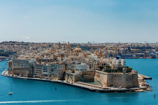 Fort St. Angelo, symbol of Malta's resilience, majestic stone walls, silent witness to rich history. Port in Birgu. View from Fort Saint Elmo. Cultural heritage of Malta