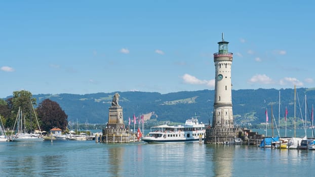 Harbor entrance of Lindau on Lake Constance, Bodensee with an arriving passenger ship