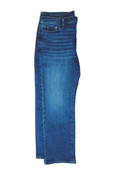 Jeans isolated. Folded trendy stylish blue denim stretch pants or trousers for men isolated on a white background. Clipping path. Jeans summer and autumn fashion.