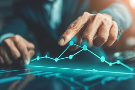 A businessman pointing at a business graph with growth trend, success concept
