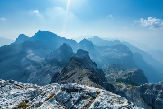 A majestic mountain range, with rugged peaks and clear skies