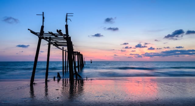 Beautiful seascape with ld abandoned wooden pier at sunset in Phang Nga province, Thailand