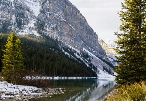 Early winter view of Fairview Mountain with reflection on Lake Louise in Banff National Park, Alberta, Canada
