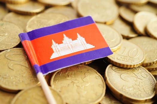Cambodia flag on coin and banknote money, finance trading investment business currency concept.