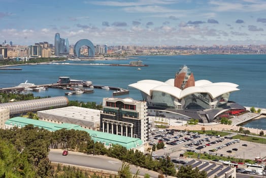 An aerial view highlights Deniz Mall in the foreground with the Crescent Development Project positioned along the Baku, Azerbaijan coastline