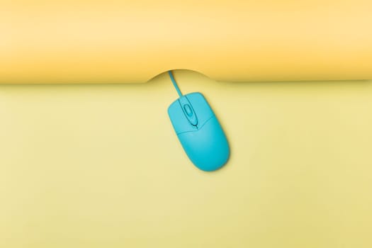 top view blue computer mouse with yellow background. High resolution photo