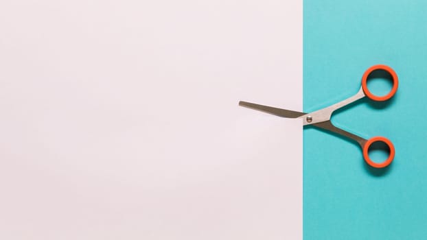 scissors cutting white paper. High resolution photo